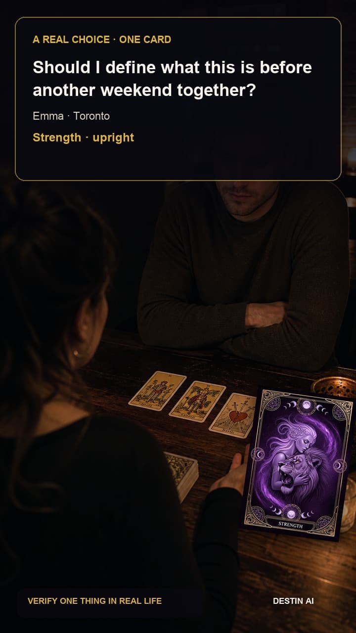 Should I define what this is before another weekend together? — seated opposite the tarot reader, studying a curved three-card spread with both hands relaxed on the table in Toronto tarot loft at night with streetcar lights outside, with Strength upright