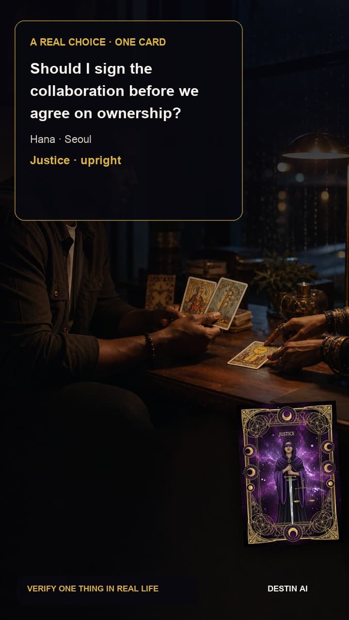 Should I sign the collaboration before we agree on ownership? — seated face-to-face with the tarot reader, following a neat four-card spread while one card is pointed out in Seoul tarot studio in the evening with soft neon beyond the window, with Justice upright